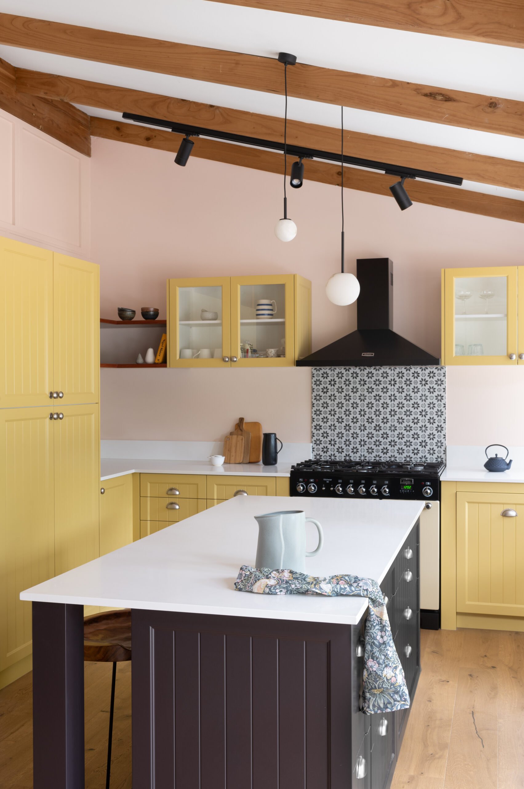 The Darlington Home project features a yellow and black kitchen, embellished with TradCo hardware.