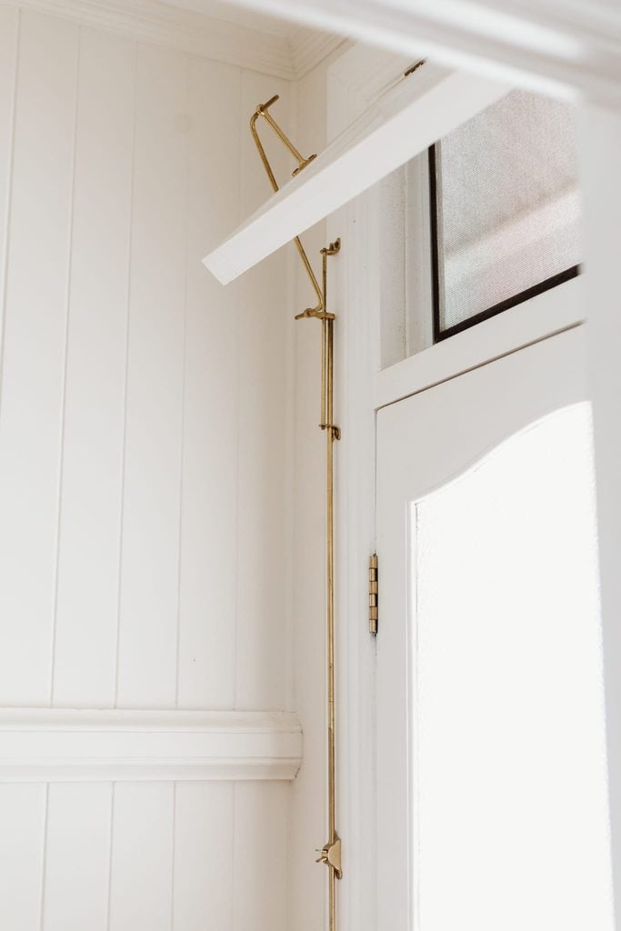 Fanlight above a door with a brass fanlight operator
