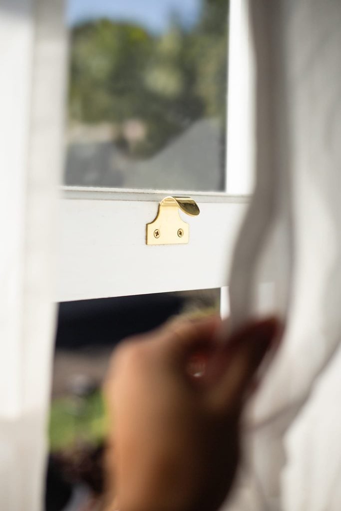 TradCo polished brass window hardware in a heritage home