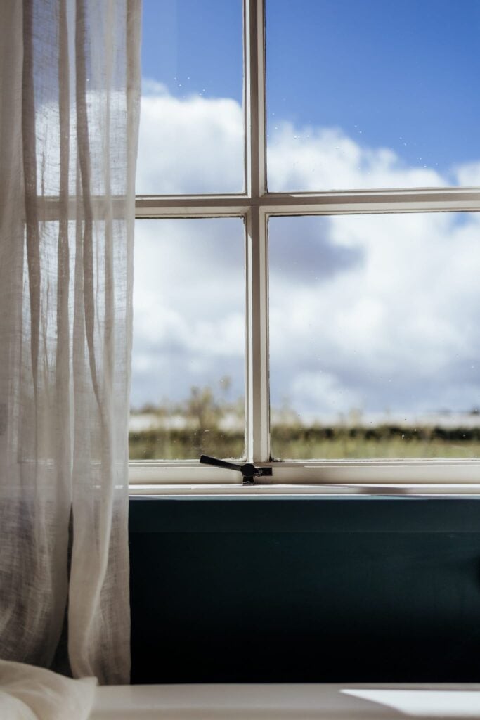 Wedge fastener on a timber awning window