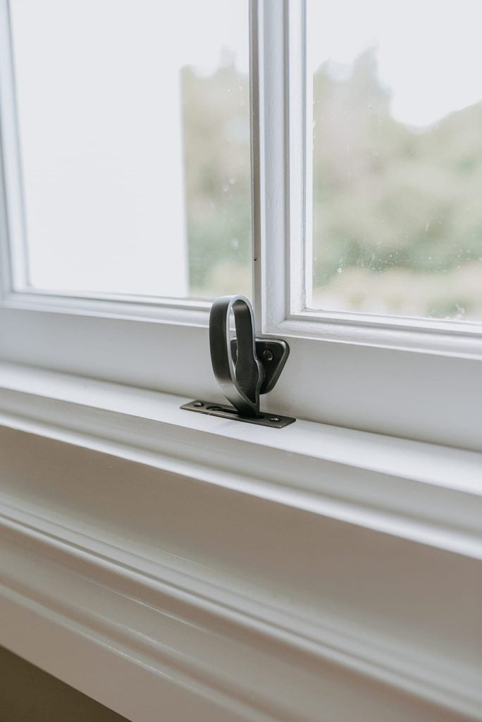 Hopper window catch on an inward-opening timber window